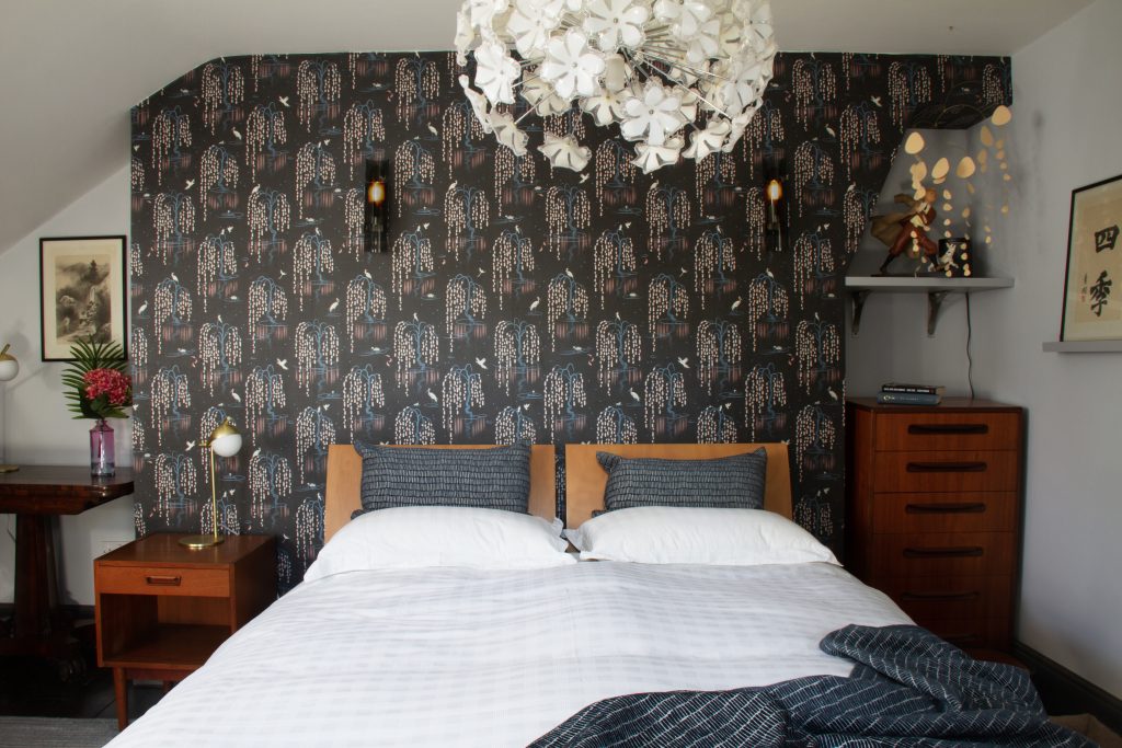 Bedroom with patterned wallpaper