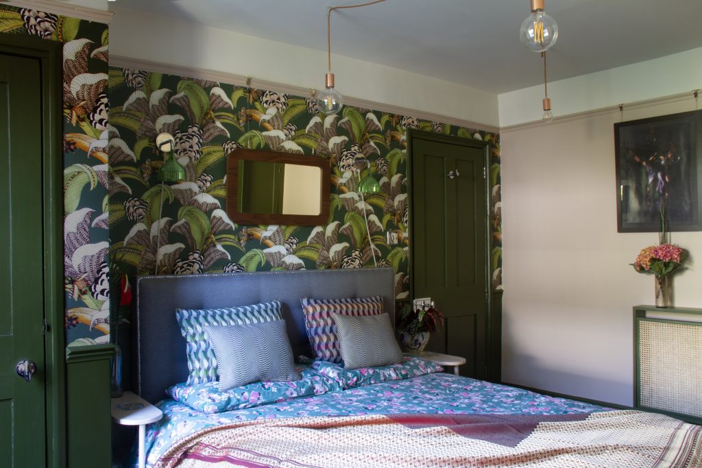 Bedroom with patterned wallpaper
